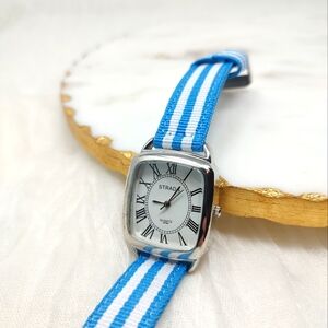 Strada blue and white striped fabric band watch silver tone frame around face